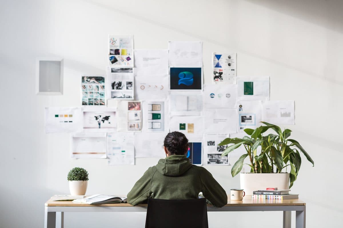 Designer at desk working on brand identity design